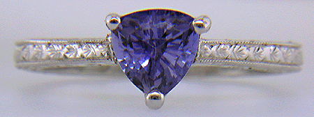 Platinum engraved ring with trillium lavender sapphire. (J6399)
