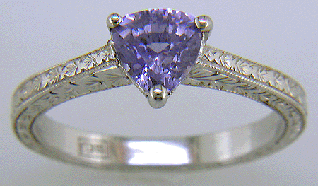 Platinum engraved ring with trillium lavender sapphire. (J6399)