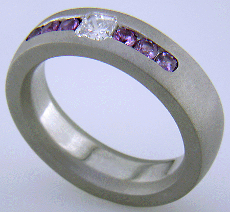 Diamond and sapphire man's custom wedding band crafted in platinum.