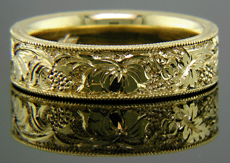 18kt gold band with hand engraved blossoms.