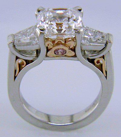 Side view of custom platinum ring set with an Asscher-cut diamond and two trapezoid-cut diamonds.
