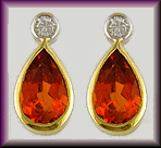 Mandarin garnet and diamond earrings in 18kt gold. (J8520)