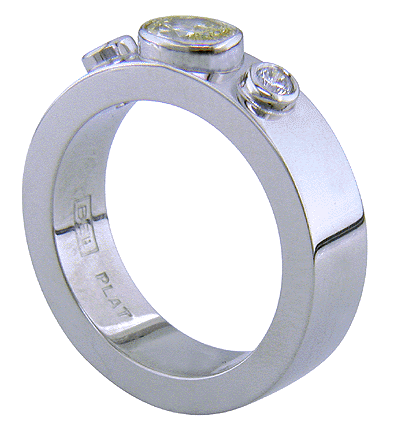 Custom platinum ring set with a yellow diamond.