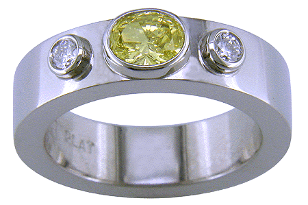 Custom platinum ring set with a yellow diamond.
