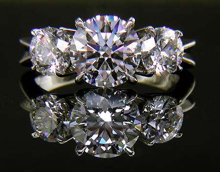Custom platinum ring with three diamonds.