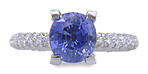 Pastel Blue Sapphire set with pave diamonds in a platinum ring. (J8426)