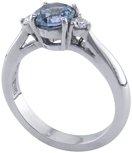 Montana Sapphire set with two round diamonds in a handcrafted platinum ring. (J8536)
