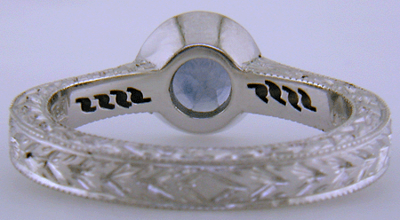 Inside view of engraved platinum ring with Montana sapphire and diamonds. (J8544)