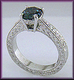 Platinum engraved ring with Montana sapphire and diamonds.