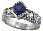 A Montana Sapphire set with diamonds in a beautifully hand-engraved platinum ring.