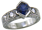 A Montana Sapphire set with diamonds in a beautifully hand-engraved platinum ring.