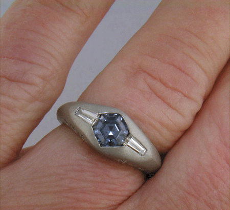 Hand-crafted Montana Sapphire and baguette diamond ring crafted in platinum. (J8433)