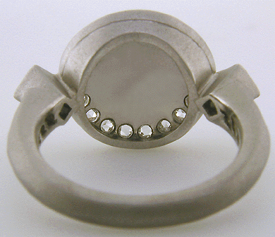 Inside of Moonstone and Rose-cut Diamond ring custom crafted in platinum. (J8519)