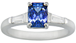 Morph-cut Sapphire with tapered baguette diamonds in a custom platinum ring.