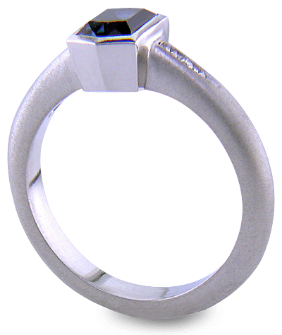 Morph-cut Sapphire with round diamonds in a custom platinum ring. (J8543)