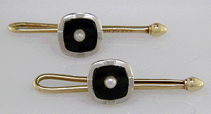 Shirt studs featuring onyx and pearls set in 14kt gold. (J5131)