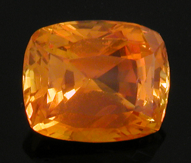 An orange cushion-cut sapphire weighing 3.13 carats. (CS8530)