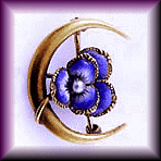 Victorian enameled pin with pansy and crescent moon.