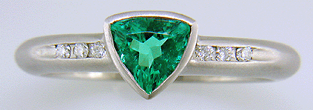 Trillium Paraiba tourmaline accented with diamonds in a custom platinum ring.