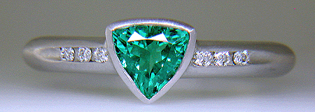 Trillium Paraiba tourmaline accented with diamonds in a custom platinum ring.