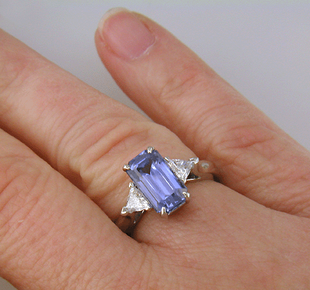 Hand-crafted platinum ring with a emerald-cut pastel Sapphire and sparkling diamonds. (J8541)