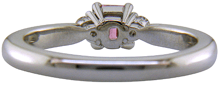 Inside view of handcrafted platinum ring with purplish-pink diamond.