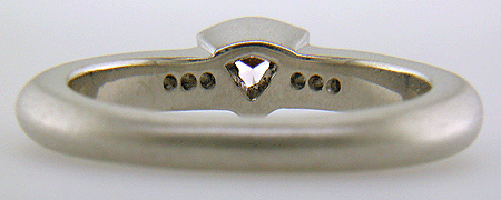 Inside view of trilliant pink diamond custom platinum ring.