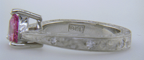Close-up of Bijoux Extraordinaire (BEL) hallmark.
