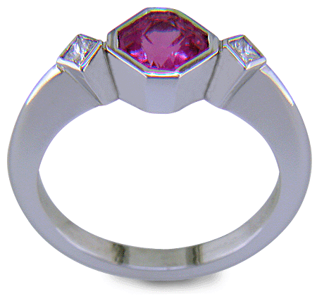 Pink Sapphire set with two Princess-cut diamonds in a platinum ring. (J8547)