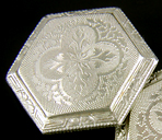 Elegantly engraved platinum and gold cufflinks. (J9118)