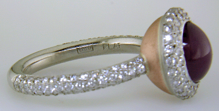 Close-up of Bijoux Extraordinaire hallmark (BEL) and platinum mark.