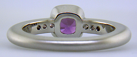 Inside view of purple sapphire set with round lilac sapphires in a custom platinum ring.
