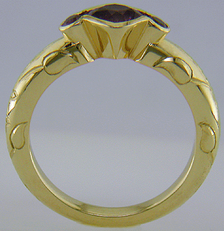 Cushion-cut Purple Sapphire with round Purple Sapphires in a custom platinum ring. (J8546)