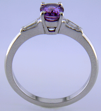 Side view of oval Purple Sapphire platinum ring.