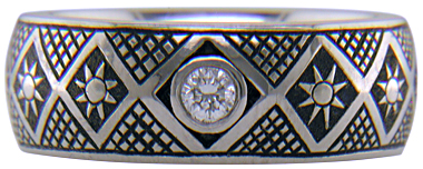 Hand engraved Pysanky ring with diamonds.
