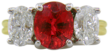 Custom red spinel trellis ring set with diamonds.