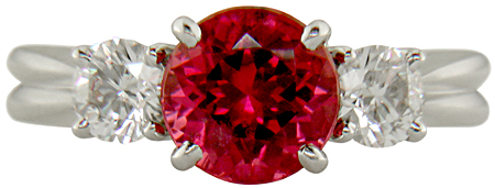 Red spinel set with twodiamonds in a beautiful platinum ring. (J7240)