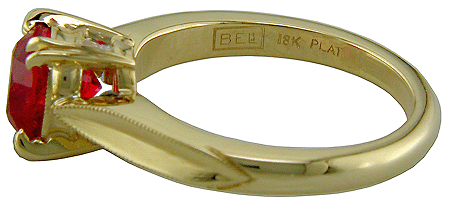 Close up of Bijoux Extraordinaire hallmark ('BEL') and precious metal marks.