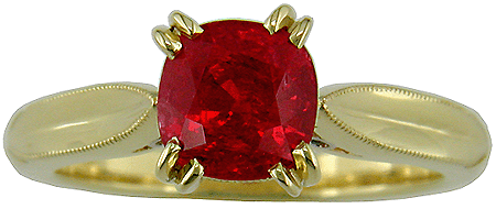 Front view of 18kt gold ring with a fiery red spinel.