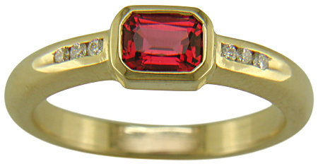 Emerald-cut red spinel set with brilliant-cut diamonds in a custom created ring. (J6776)