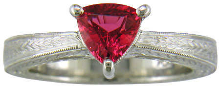 Hand engraved platinum ring with a trillium red spinel.