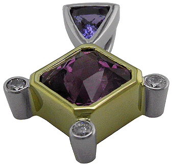 Sapphire and rhodolite garnet pendant crafted in platinum and 18kt gold.