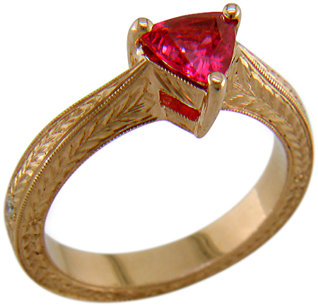 Hand engraved rose gold ring with a trillium red spinel.