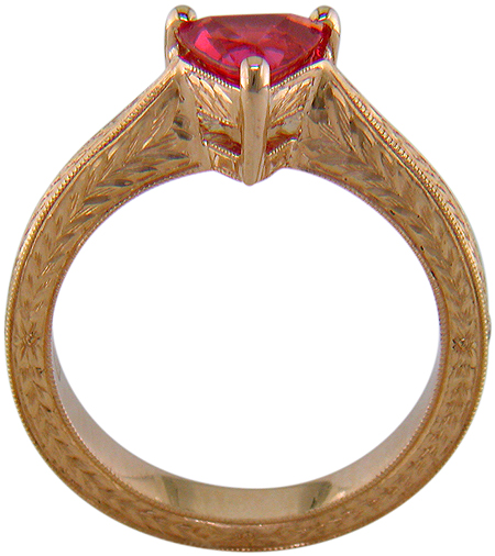 Side view of hand engraved rose gold ring with a trillium red spinel.
