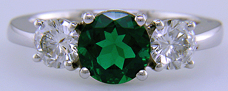 Diamond and emerald ring in platinum.