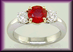 Round ruby and diamond ring in platinum.