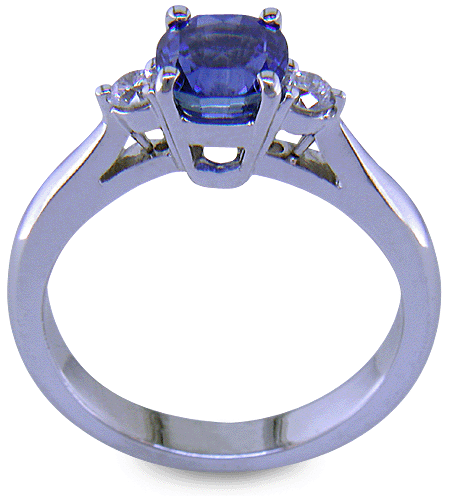 Cushion-cut sapphire set with two round diamonds in a handcrafted platinum ring. (J8598)