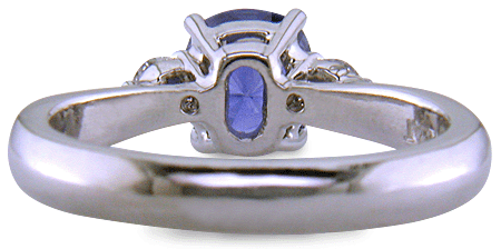 Inside view of Cushion-cut sapphire set with two round diamonds in a handcrafted platinum ring. (J8598)