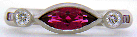 Hand-crafted platinum ring set with a Rubellite Tourmaline and diamonds. (J6651)