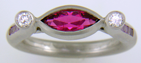 Hand-crafted platinum ring set with a Rubellite Tourmaline and diamonds. (J6651)